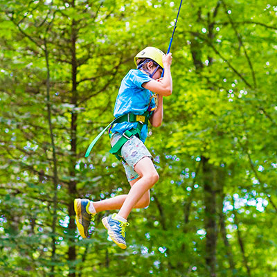 boy on zipline harness