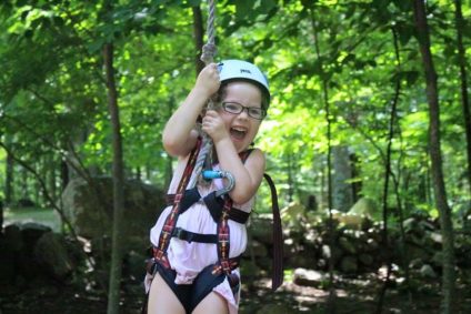 young girl zip lining